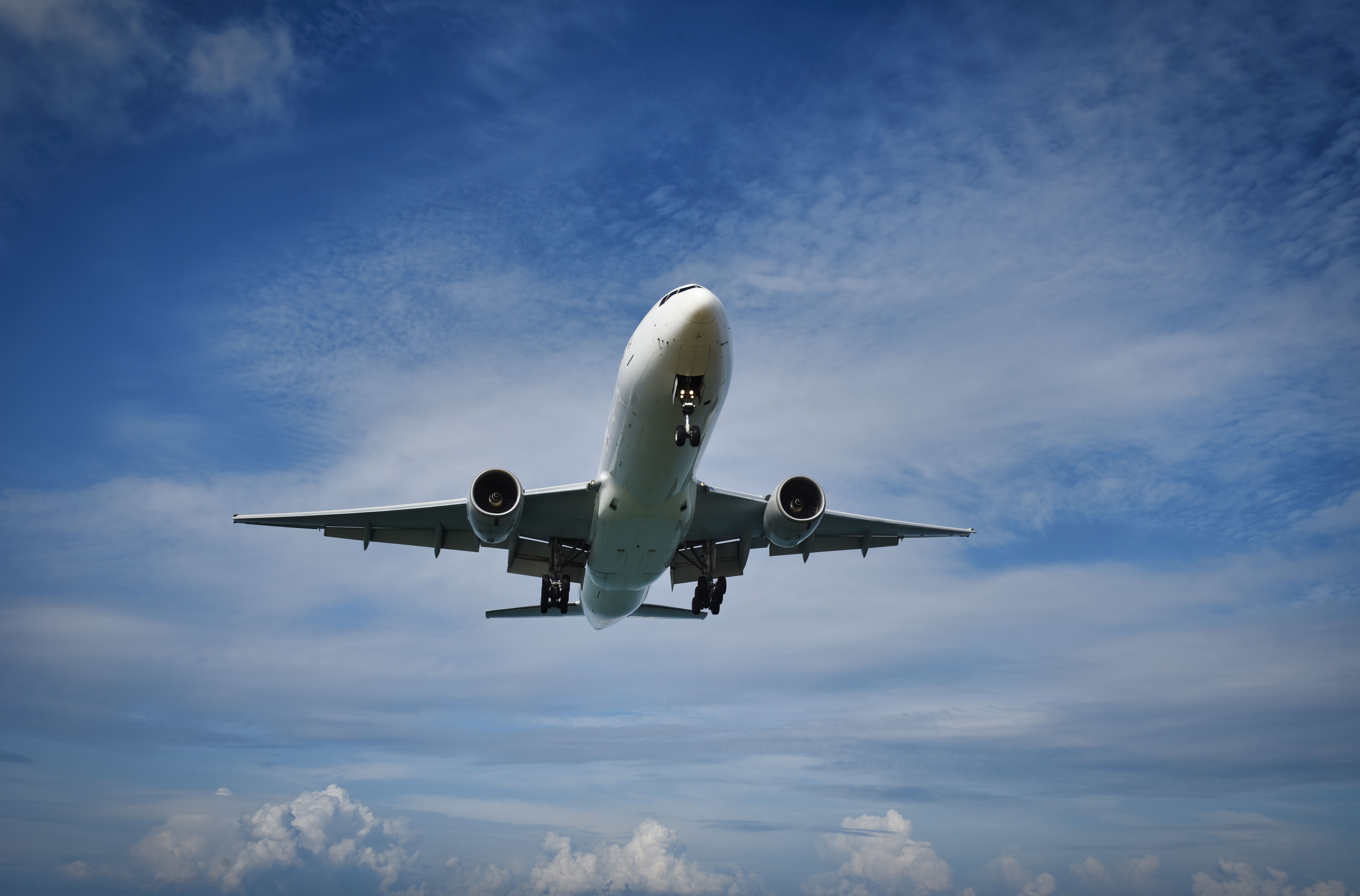Should We Fly Less or Fly More Efficiently
