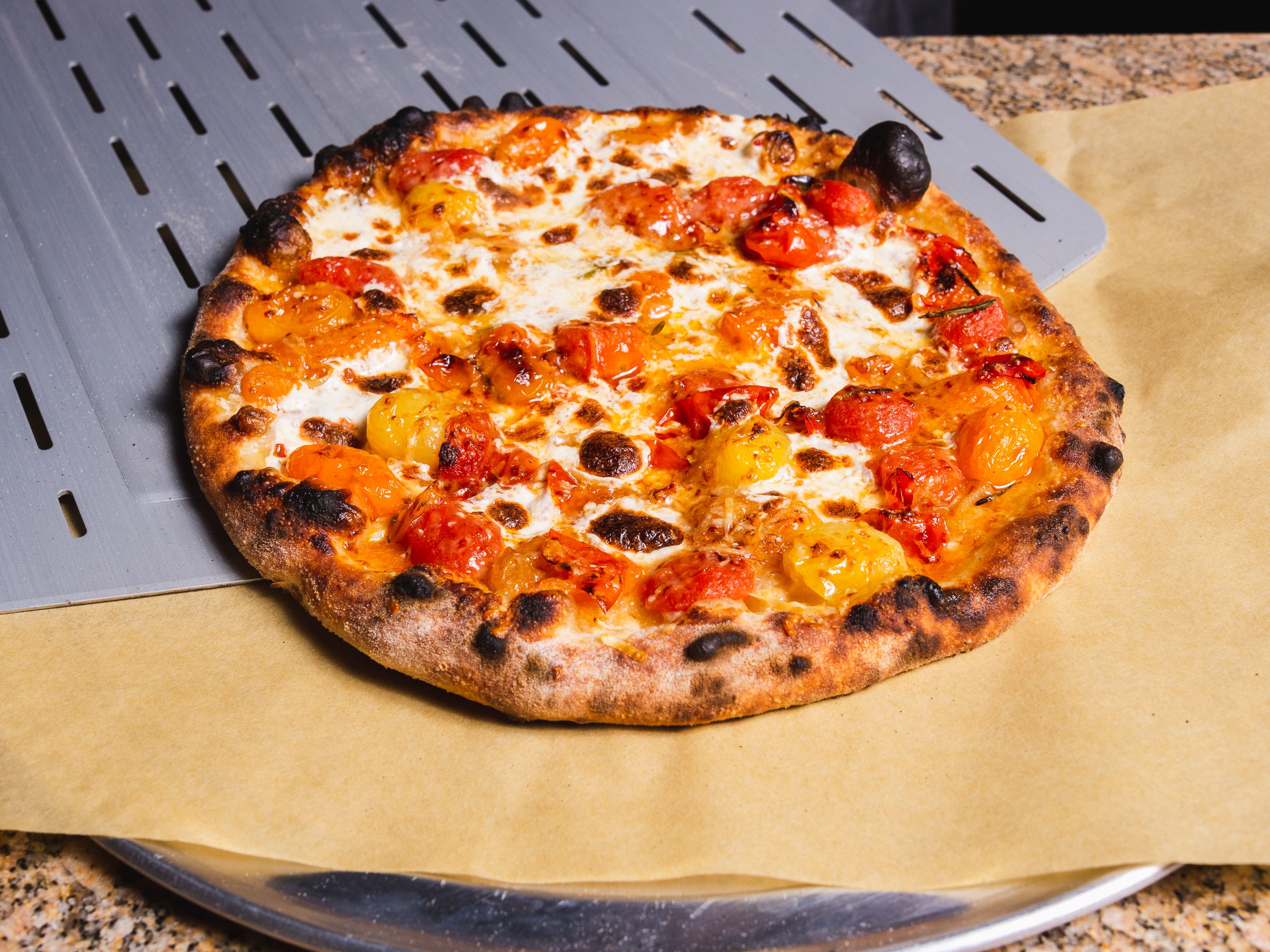 Outdoor Pizza Oven Burst Cherry Tomato, Shallot, and Herb Pizza