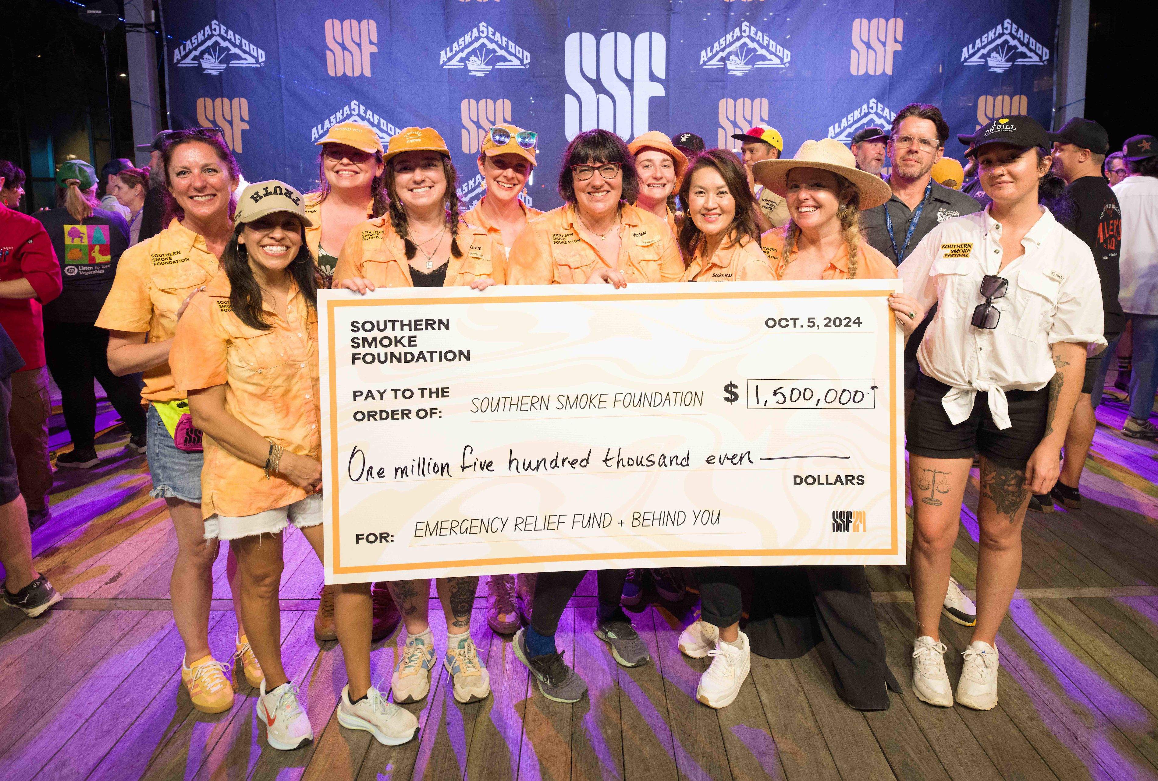 People holding a giant check